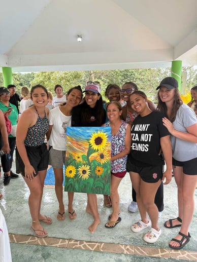 Archer_RuizMaciandothergirlswithsunflowerpainting_courtesyofAmeliaRuiz