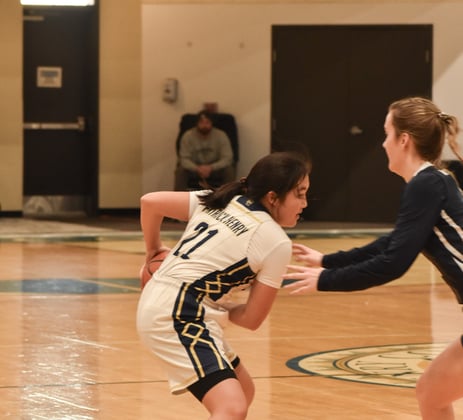 PHC's Hannah Kim posed to attack the basket