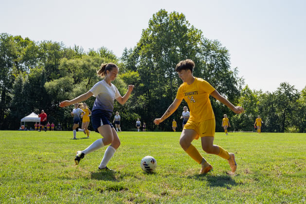 Junior Madeline Reiger challenges the ball