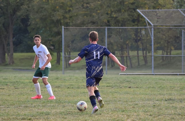 Junior Aidan Hartman plays the ball