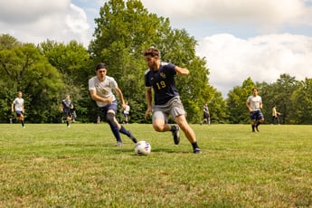 Sophomore Josiah Jackson defends an alumnus