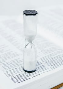 hourglass on book