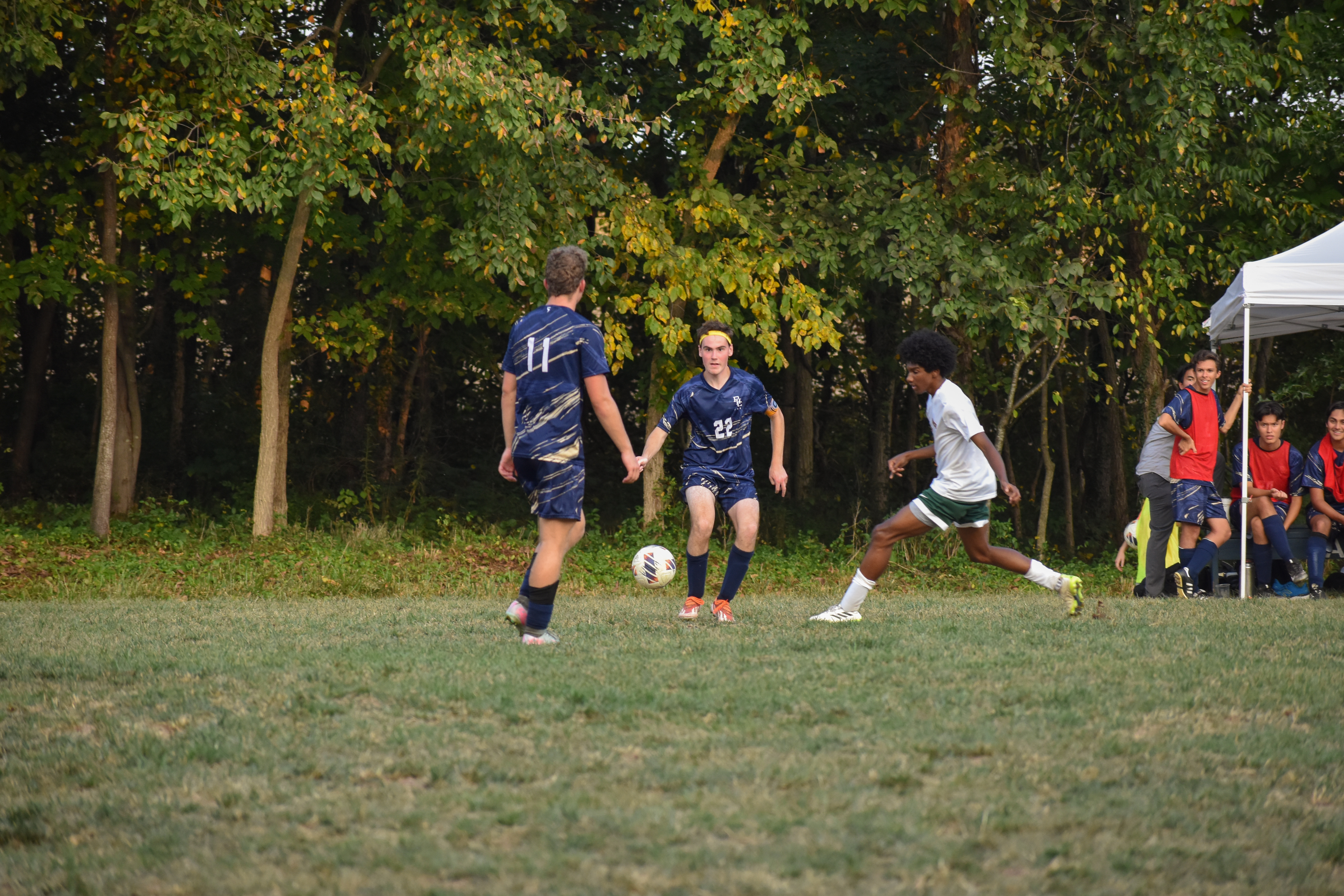Captain Josh Meyers sends a pass to Junior Aidan Hartman